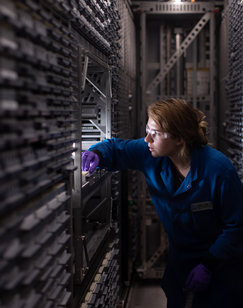 A scientist working inside the CDoT library